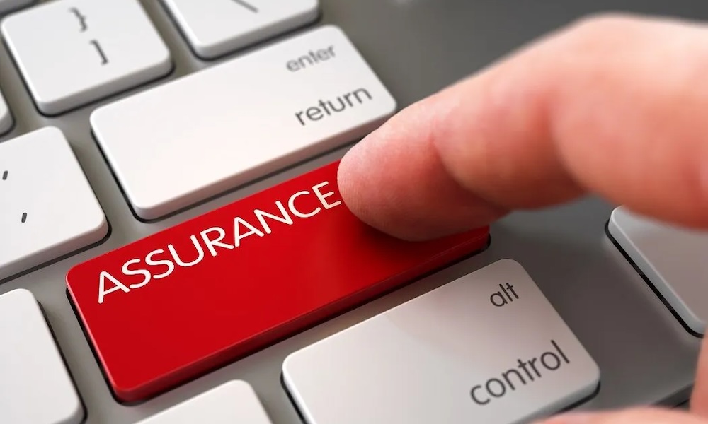 A finger presses a large red keyboard key labeled 